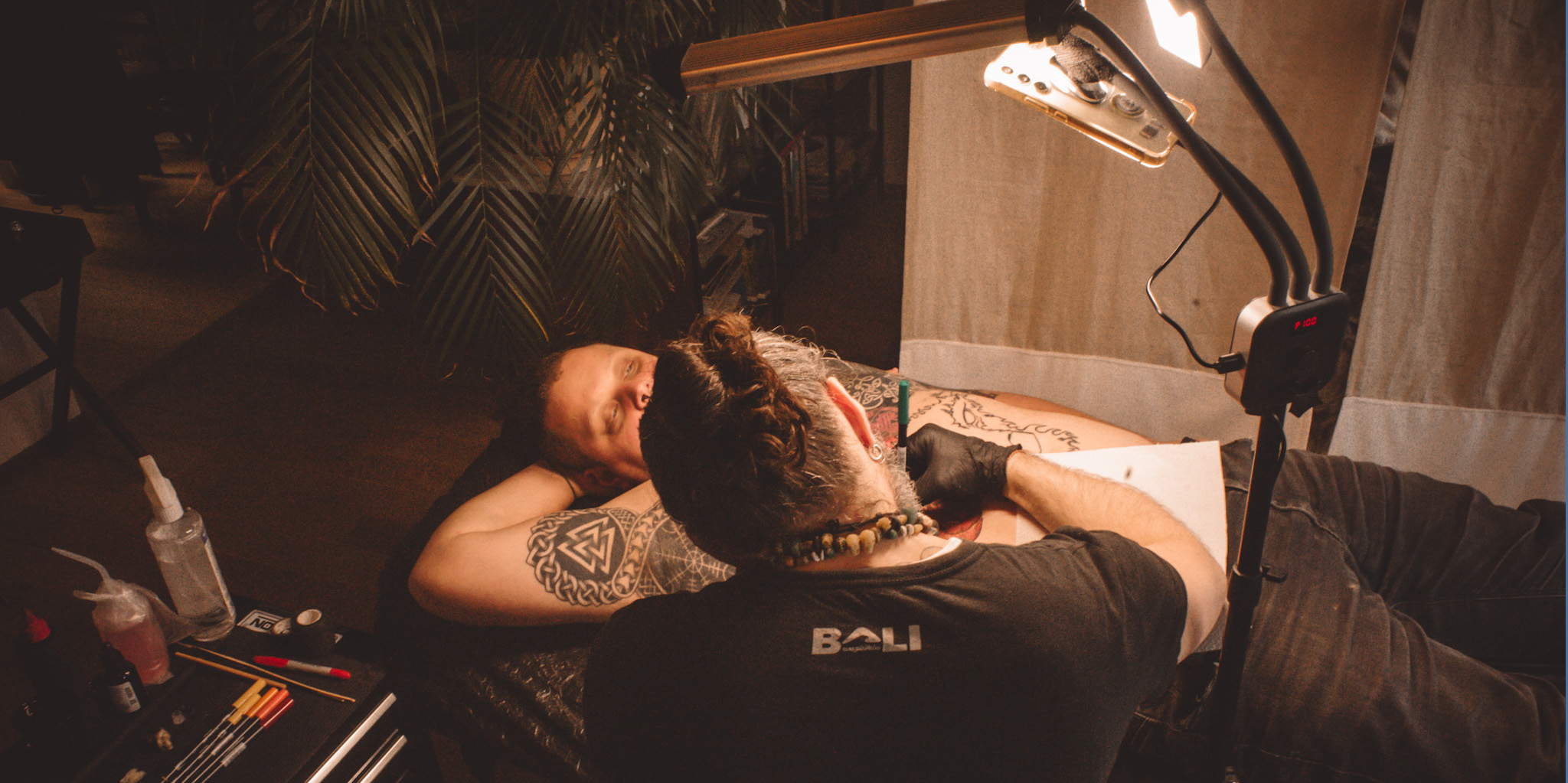 Handpoke tattoo session in the studio